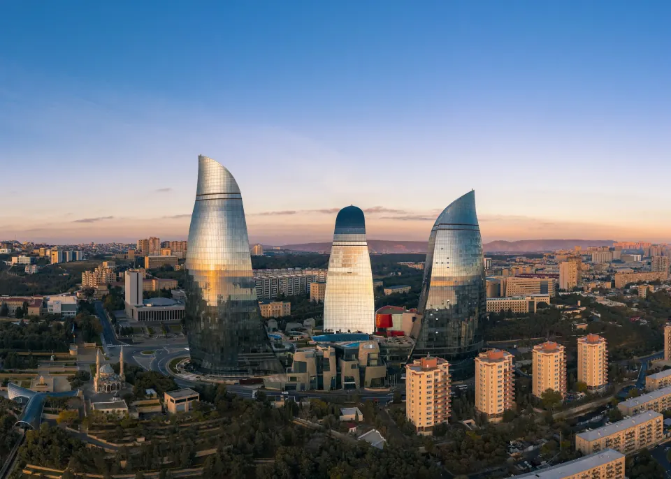 Baku Flame Towers at sunset above the city